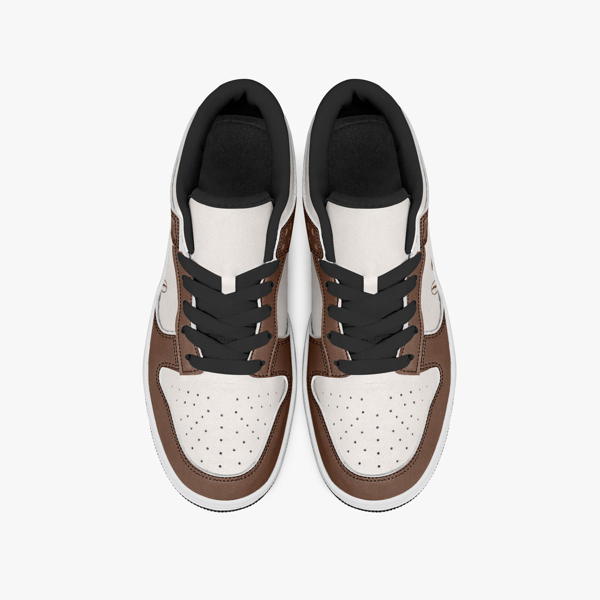Overhead view of brown and cream sneakers displaying black laces, black padded collar lining, and perforated off-white leather toe boxes.