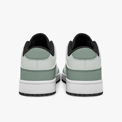 Rear view of sage green and off-white sneakers showing sage green heel overlays, off-white leather collars, and black interior collar lining above white midsoles.