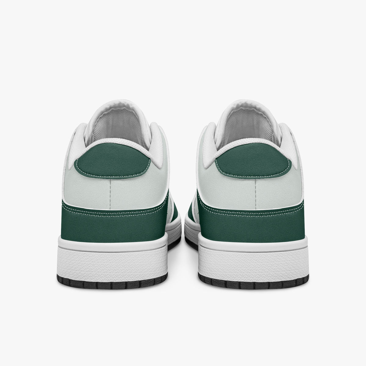 Rear view of forest green and white sneakers displaying dark green heel overlays, white leather collar panels, and two-tone white and black rubber outsoles.
