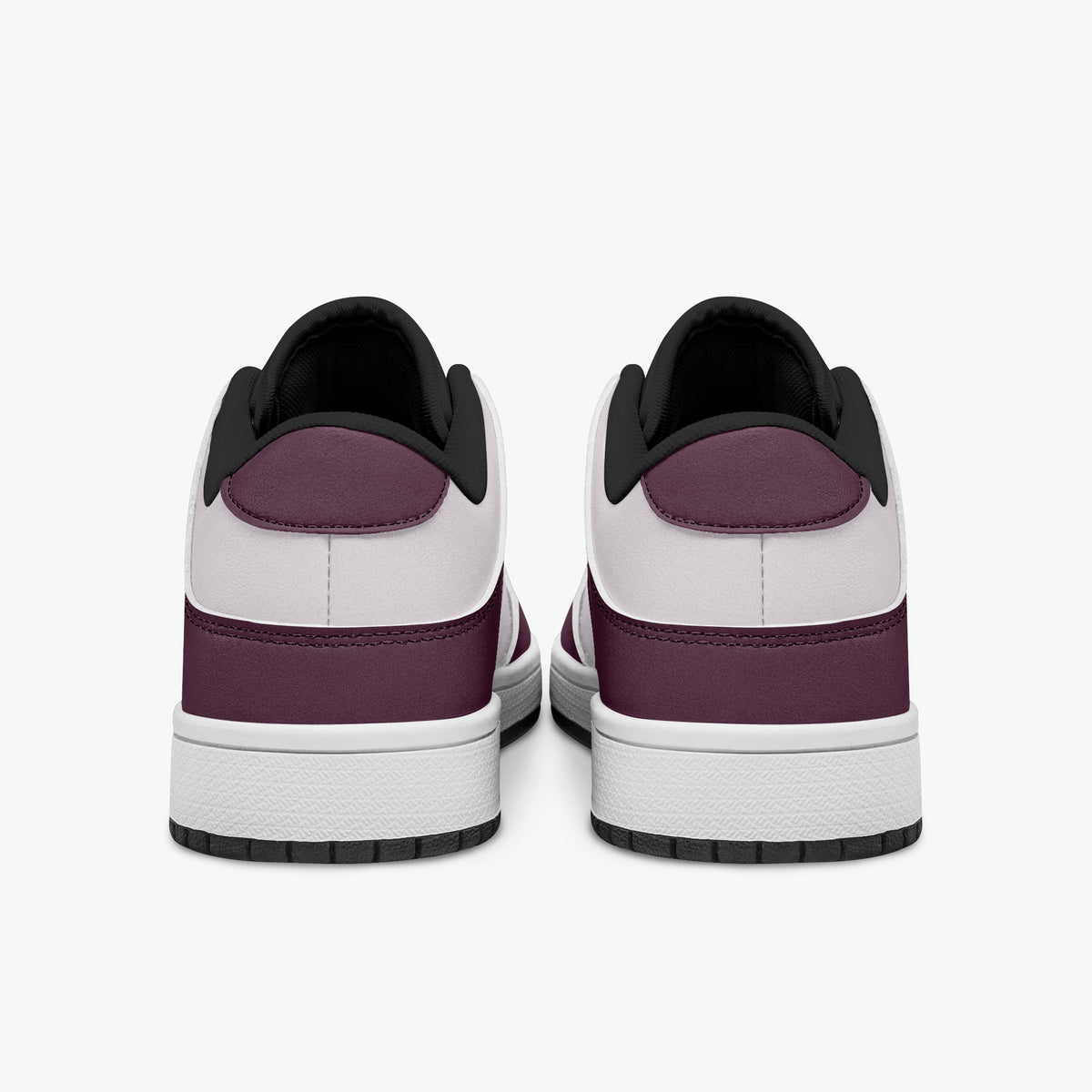 Rear view of burgundy and pale pink sneakers showing dark burgundy heel overlays, pale pink collar panels, and black interior collars above white midsoles.