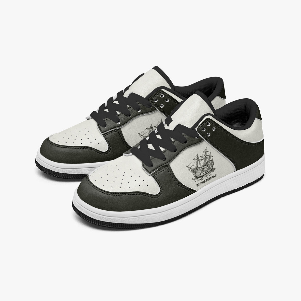 Angled three-quarter view of low-top sneakers in charcoal olive-grey and off-white leather, featuring a vintage sailing shipwreck graphic with "WEATHERED BY TIME", black laces, and a black inner lining.