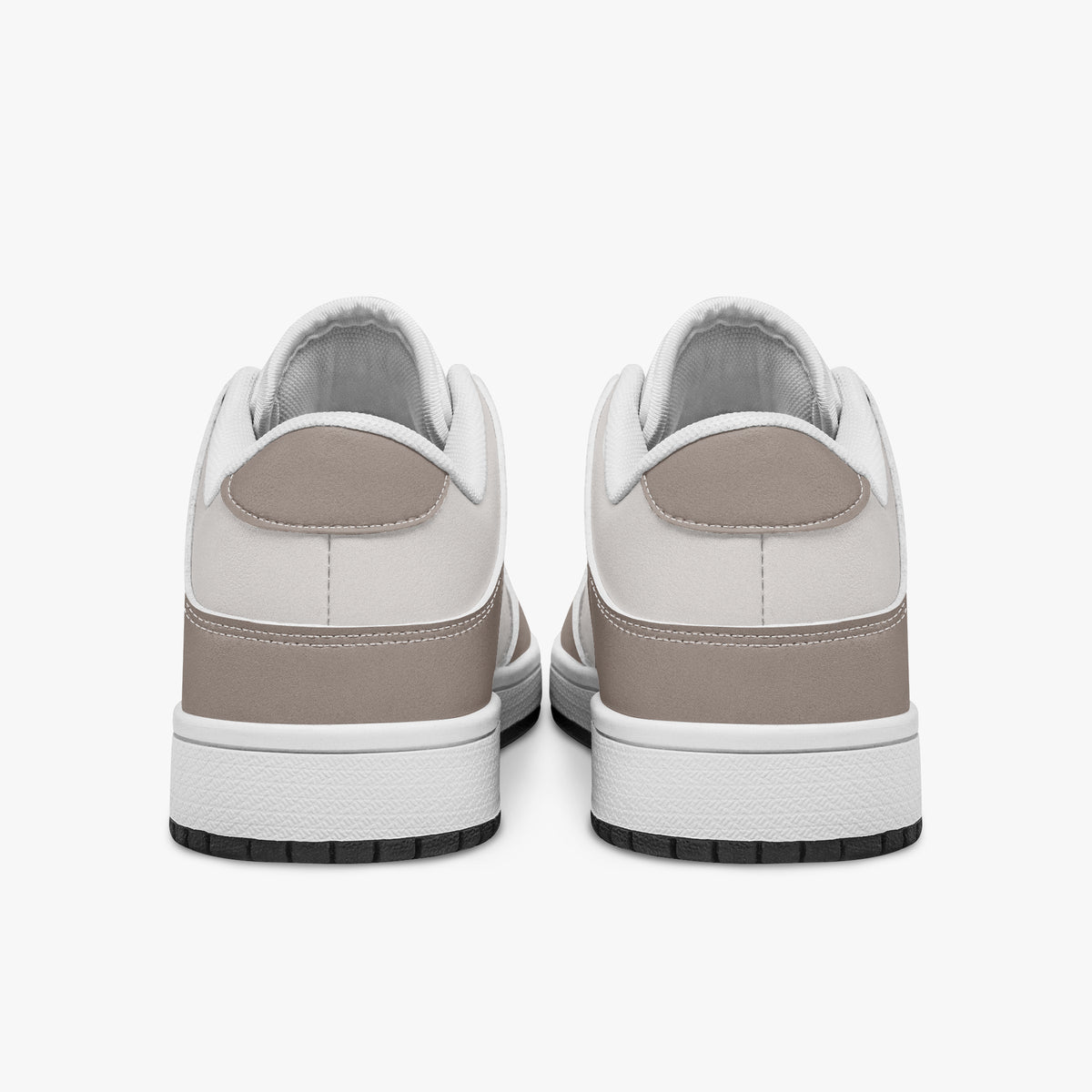 Rear view of taupe and off-white sneakers displaying taupe heel overlays, light off-white collar panels, and two-tone white and black rubber outsoles.