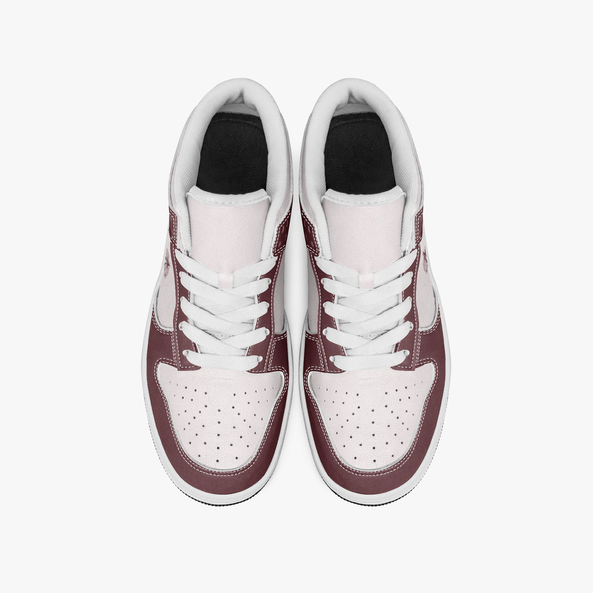 Overhead view of burgundy and pale pink sneakers showing clean white laces, white padded collar lining, and perforated pale pink toe boxes.