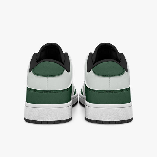 Rear view of forest green and white sneakers showing dark green heel overlays, white leather collars, and black interior collar lining above white midsoles.