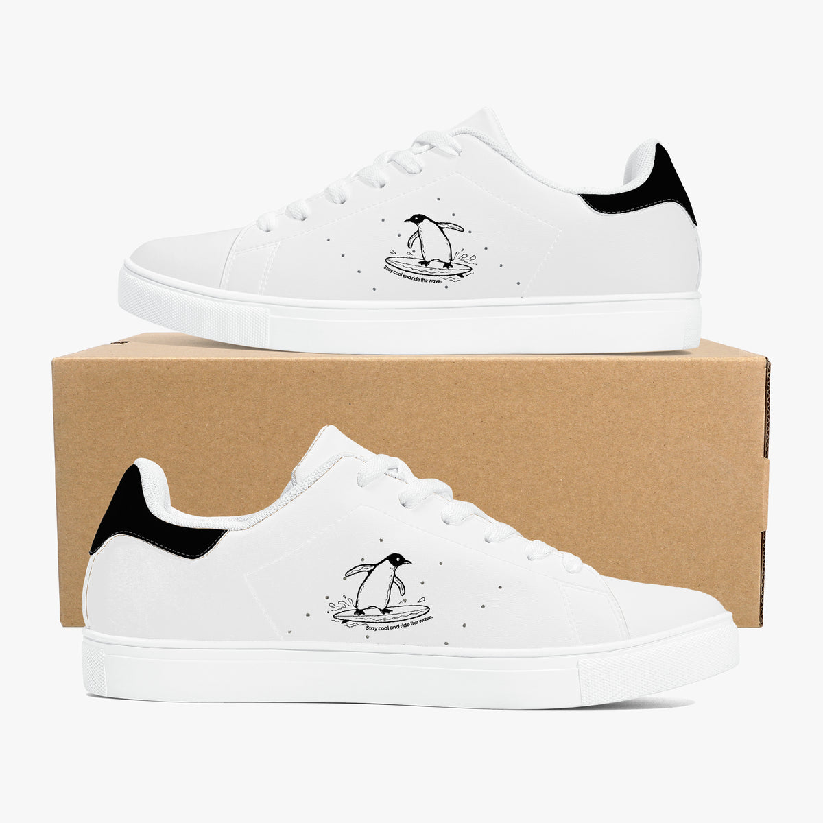 White sneakers with black accents and cartoon characters on a cardboard box