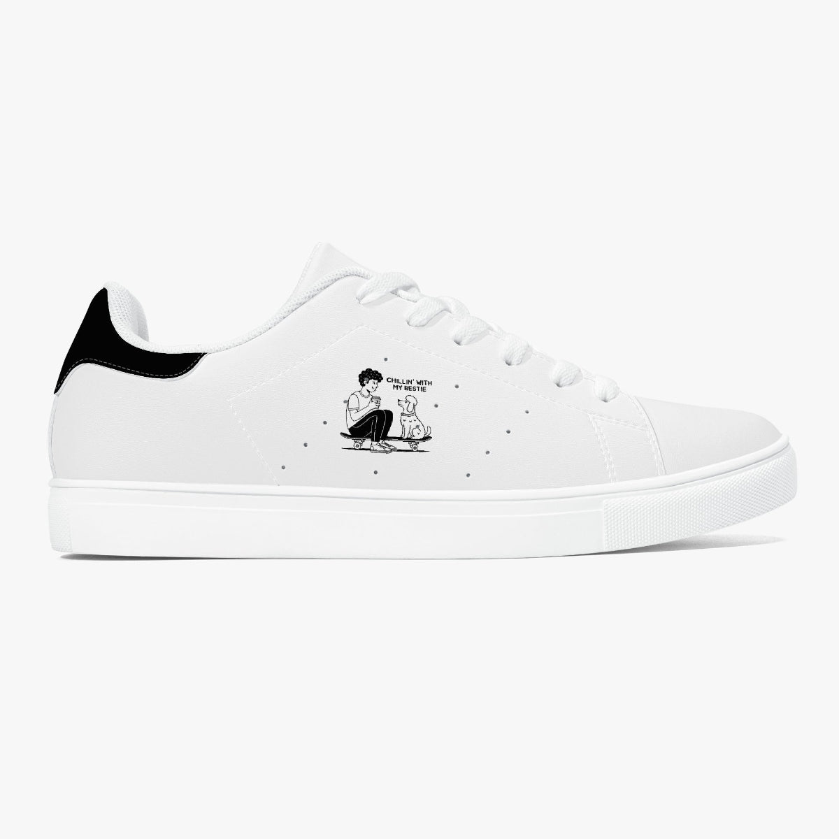 A white low-top sneaker with a black heel tab and a cartoon graphic