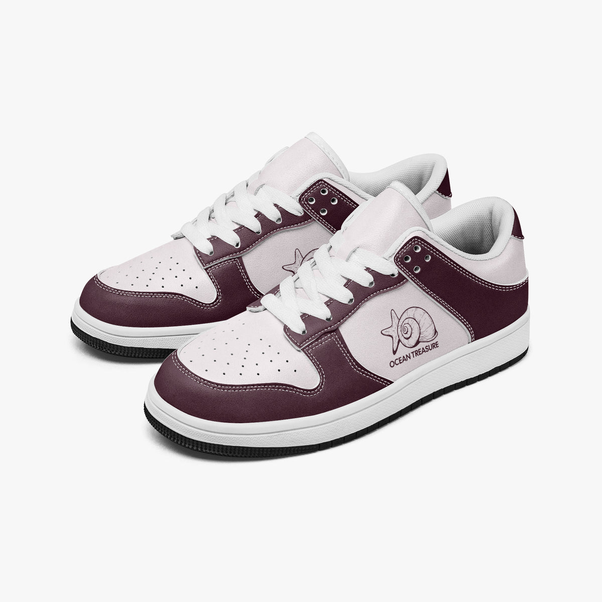 Angled three-quarter view of low-top sneakers in burgundy and pale pink leather, featuring a seashell and starfish graphic with "OCEAN TREASURE", white laces, and a white inner lining.