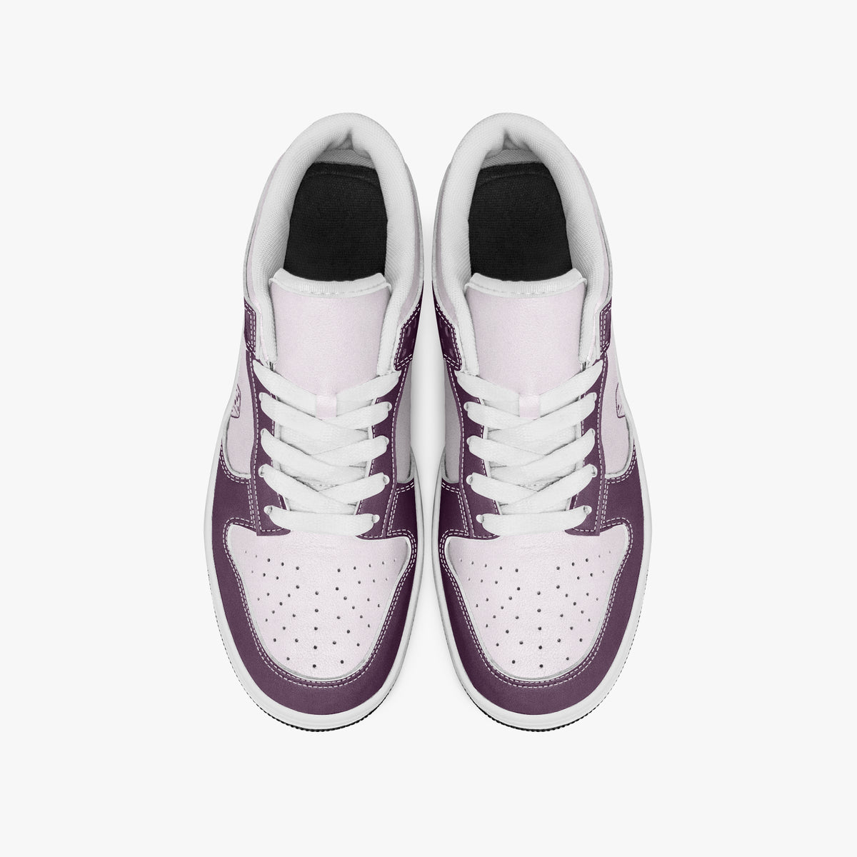Overhead view of plum purple and pale lilac sneakers showing white laces, white padded collar lining, and perforated lilac toe boxes.