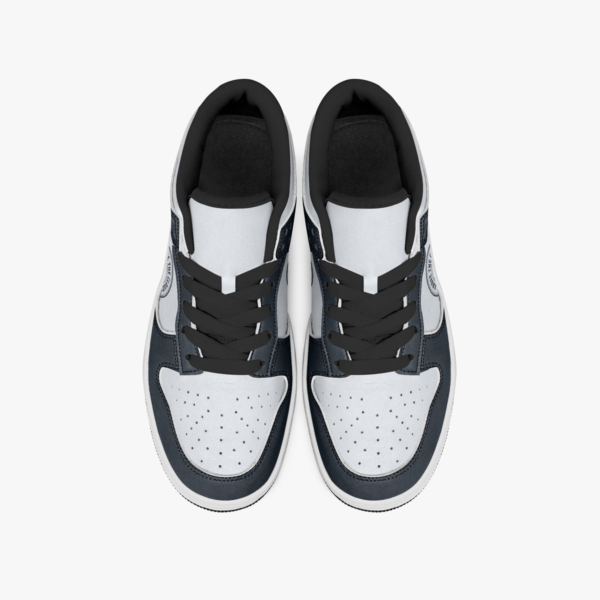 Overhead view of navy blue and off-white sneakers displaying black laces, black padded collar lining, and perforated white leather toe boxes.