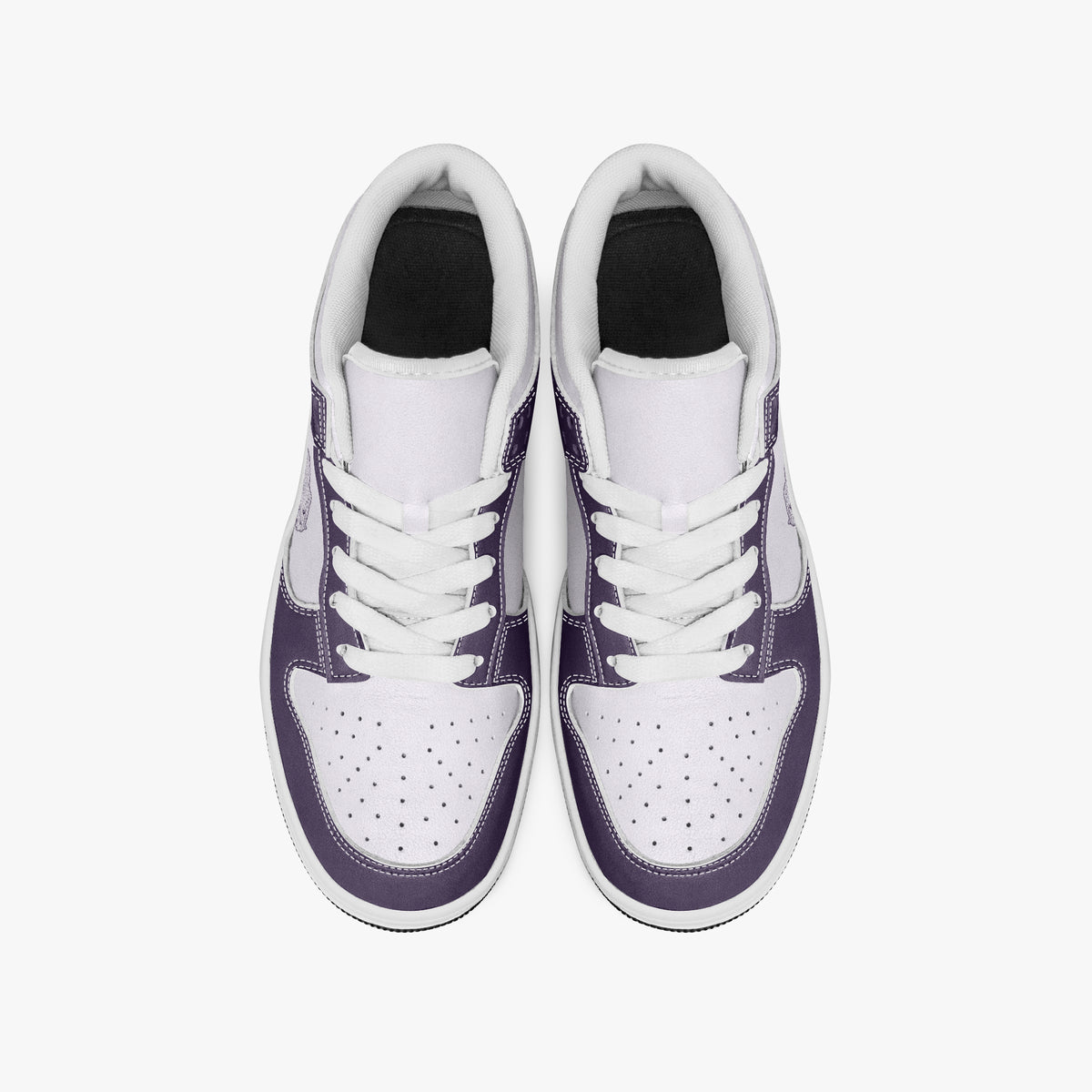 Overhead view of deep purple and white sneakers showing white laces, white padded collar lining, and perforated white leather toe boxes.
