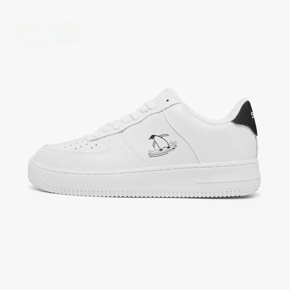 Outer side view of the left shoe in white, showcasing a surfing penguin graphic with small text and a black heel accent facing left.