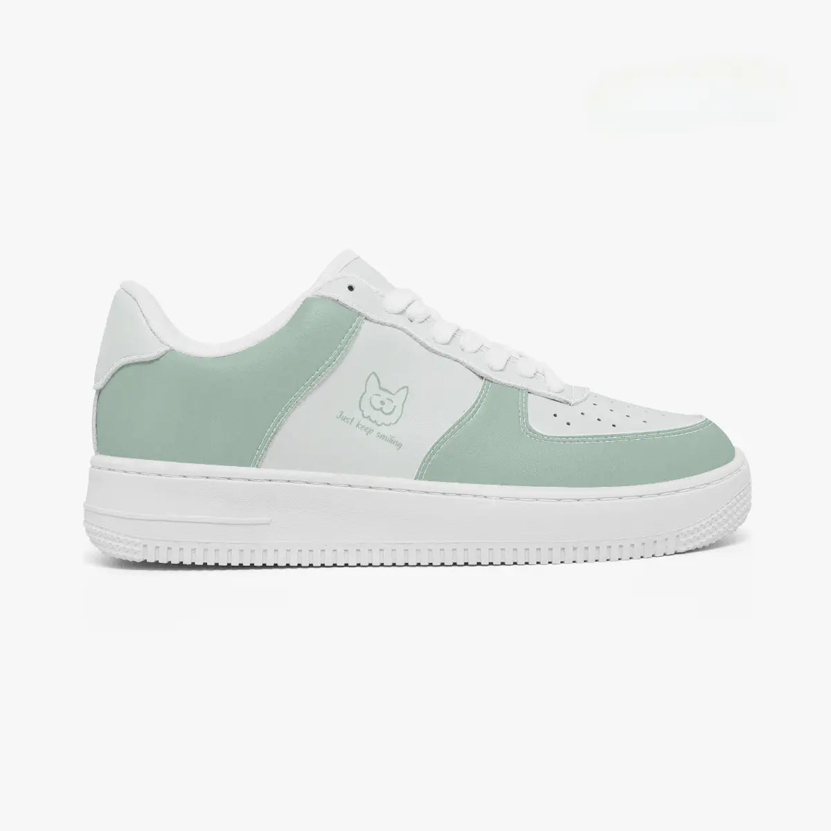 A low-top sneaker in mint green and white, featuring a white rubber sole, white laces, and a mint green cat logo on the side panel.