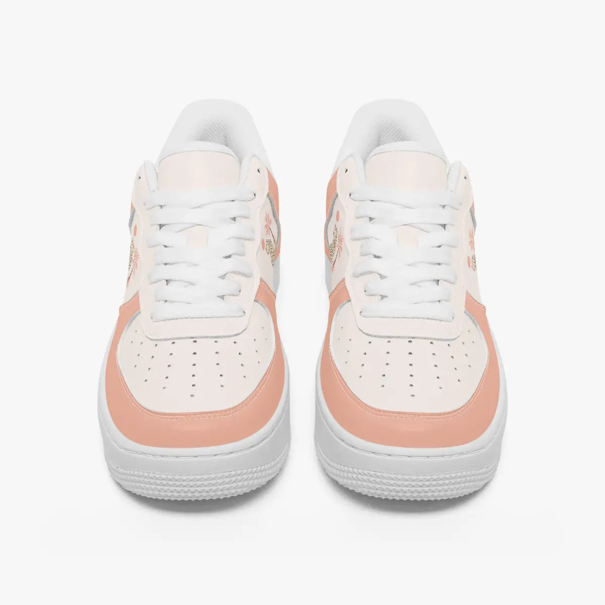 Front view of a pair of dusty peach and off-white low-top sneakers with white laces and perforated toe caps on a plain background.