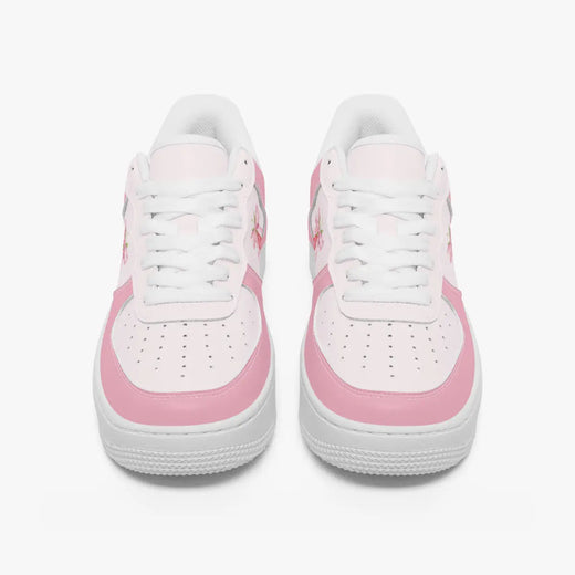 Front view of a pair of pastel pink and soft white low-top sneakers with white laces and perforated toe caps on a clean white background.