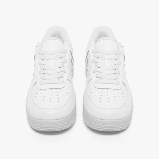 A pair of white low-top sneakers shown from the front on a clean, light gray-white background.