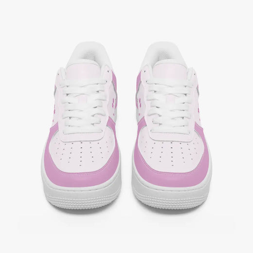 A pair of white low-top sneakers with light pink side panels and matching pink accents on the toe and heel, shown from a front-facing perspective on a clean white background.