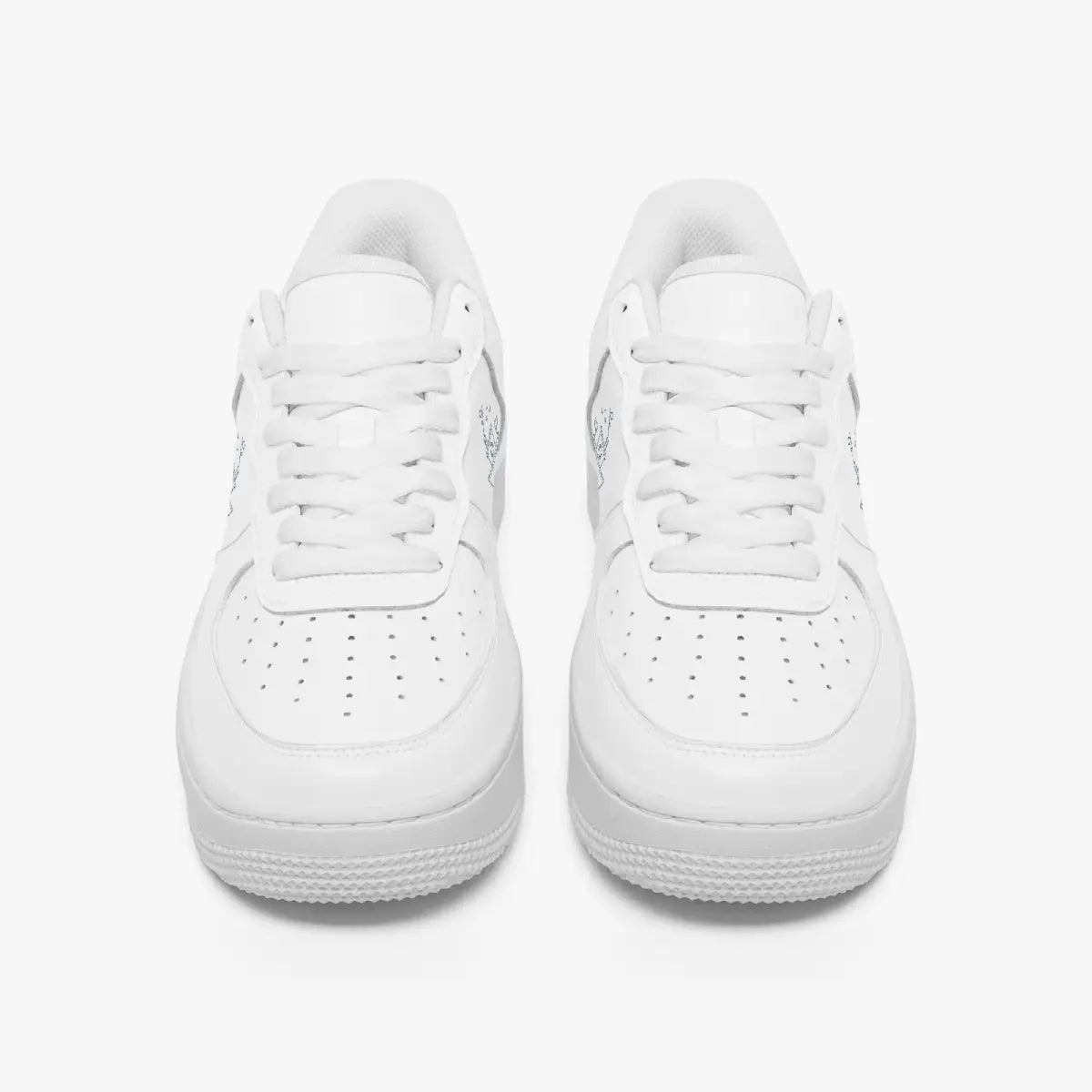 Front view of a pair of minimalist all-white low-top leather sneakers with white laces and perforated toe caps on a clean white background.