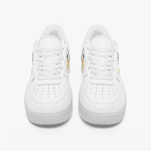 Front view of a pair of clean white low-top leather sneakers with white laces and perforated toe caps on a plain background.