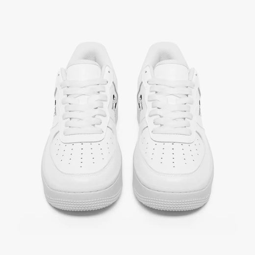 Front view of a pair of minimalist all-white low-top leather sneakers with white laces and perforated toe caps on a clean white background.