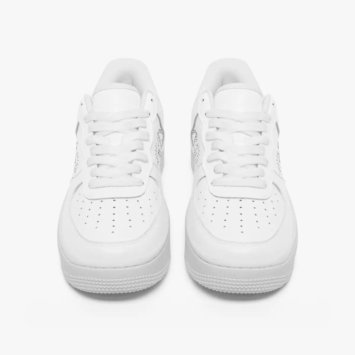 Front view of a pair of minimalist all-white low-top leather sneakers with white laces and perforated toe caps on an isolated white background.