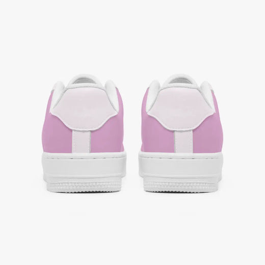A pair of low-top sneakers shown from the back, featuring a light pink canvas upper with white laces, white midsoles, and white rubber soles, set against a plain light gray background.