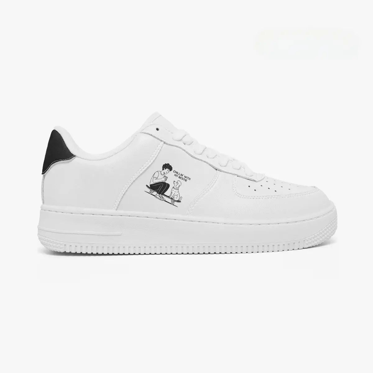 Outer side view of the right sneaker in white leather, highlighting the boy and dog skateboarding graphic and black heel accent facing right.