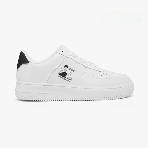 Outer side view of the right sneaker in white leather, highlighting the boy and dog skateboarding graphic and black heel accent facing right.