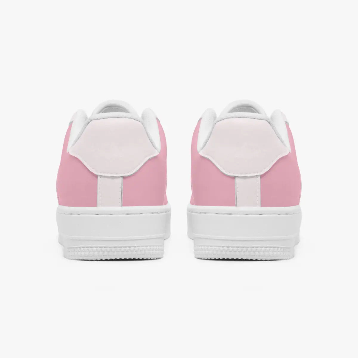 Rear view of a pair of pastel pink low-top sneakers showing the light pink heel tabs and thick white rubber outsoles.