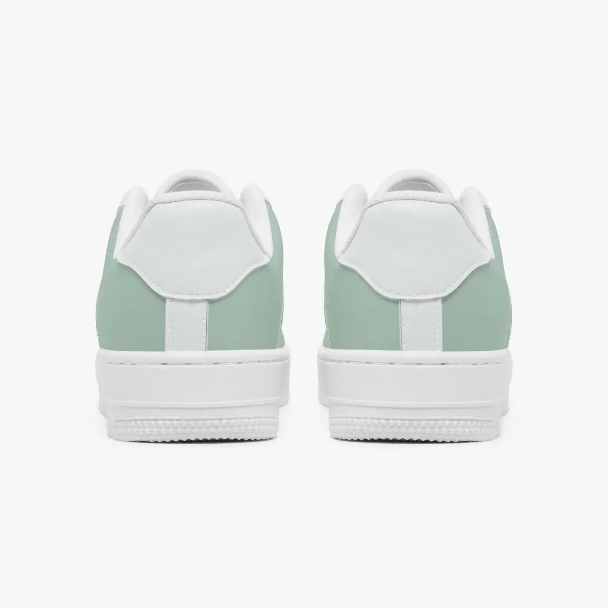 A pair of low-top sneakers shown from the back, featuring a mint green leather upper and a white rubber sole, set against a plain light gray background.