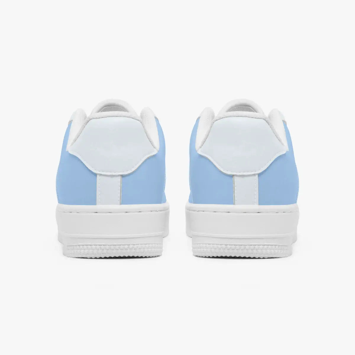 Rear view of a pair of light blue and white low-top sneakers displaying the heel tabs and white textured soles.