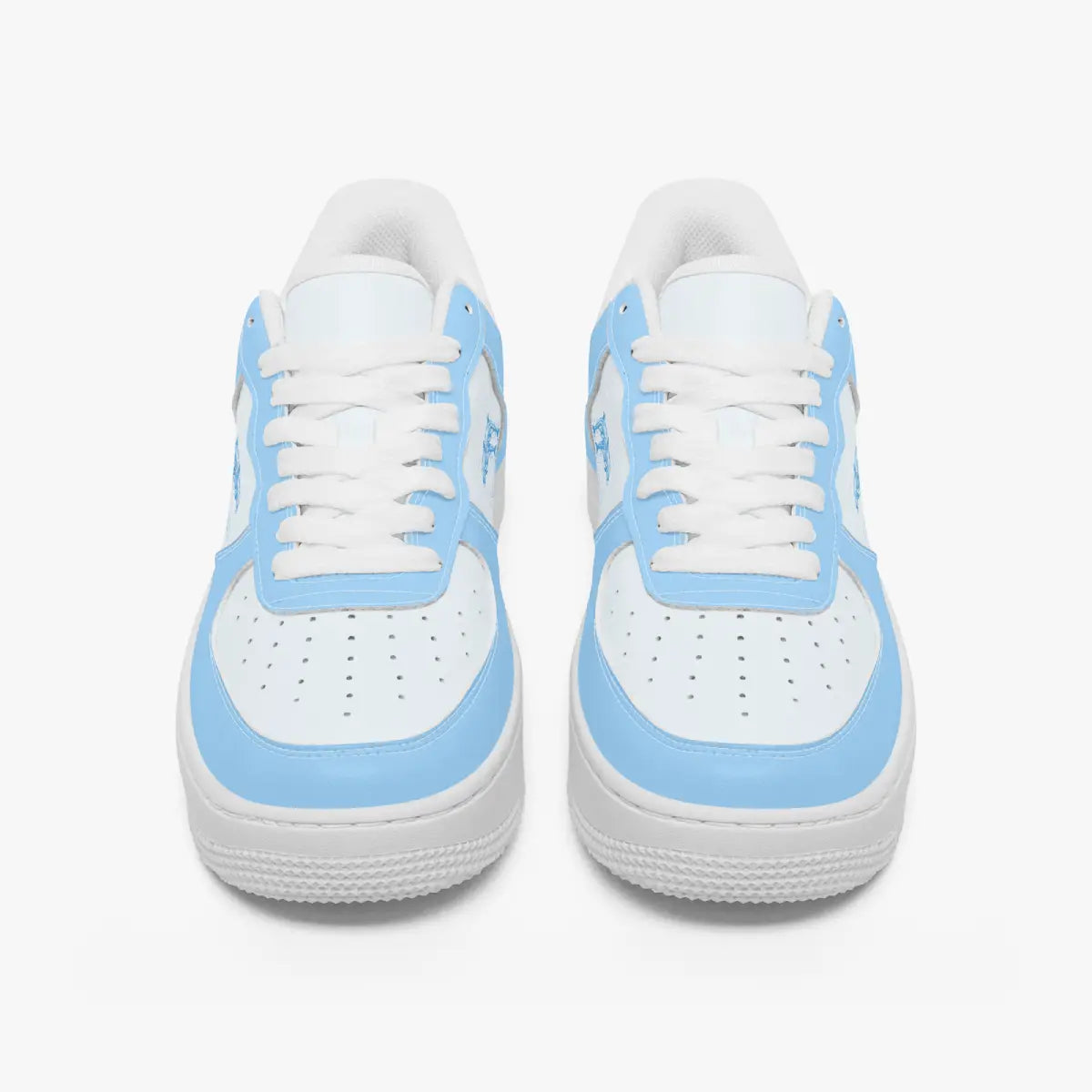 Front-facing top angle of low-top sneakers in sky blue and white leather, displaying clean white laces, sky blue eyestays, and perforated white toe boxes.