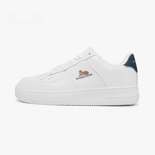 A white low-top sneaker with a navy blue heel tab, featuring the 'INVINCIBLE SCARS' logo in orange and blue on the side and a small orange cat graphic above it.