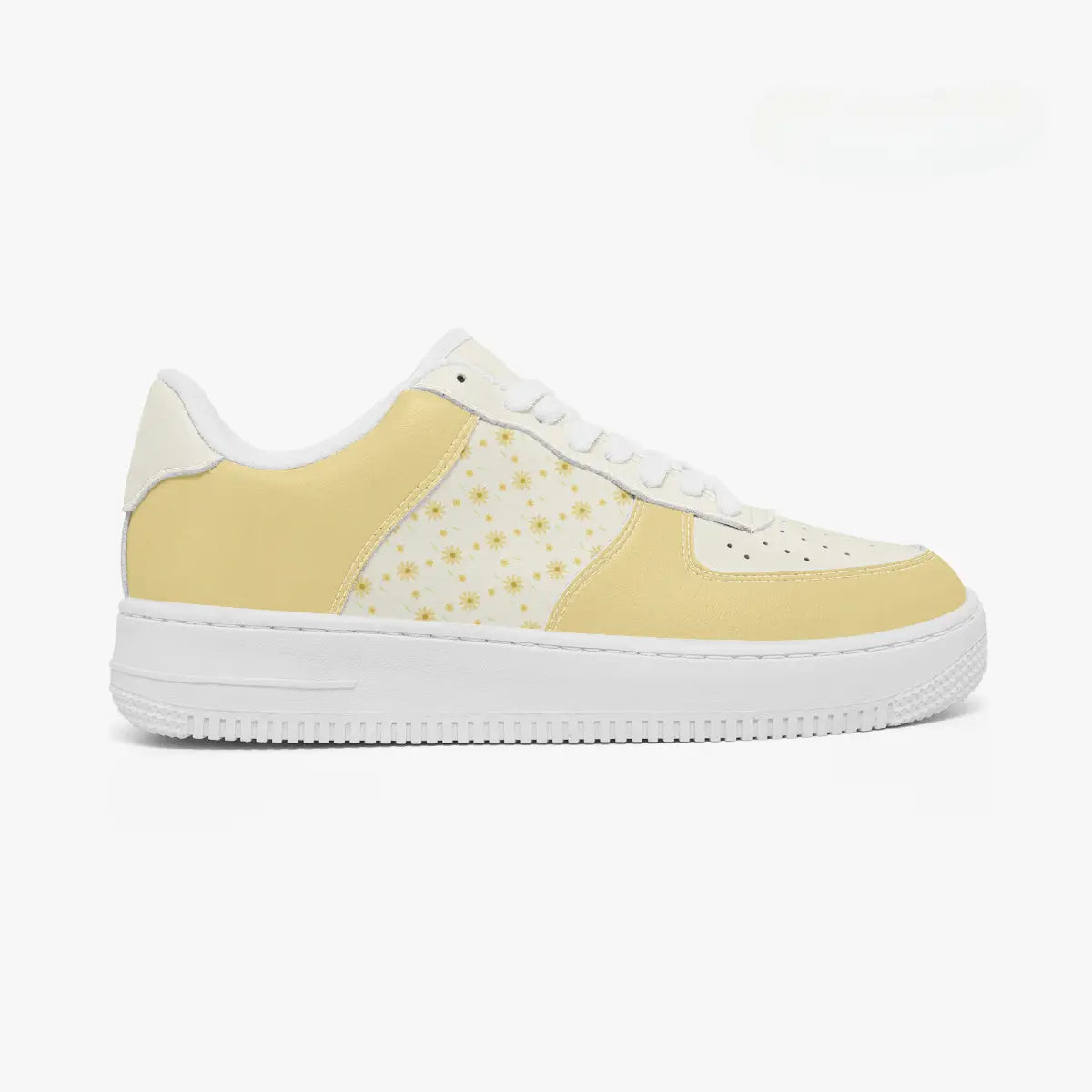 Outer side view of the right shoe highlighting the yellow leather overlays, floral side panel pattern, and thick white midsole facing right.