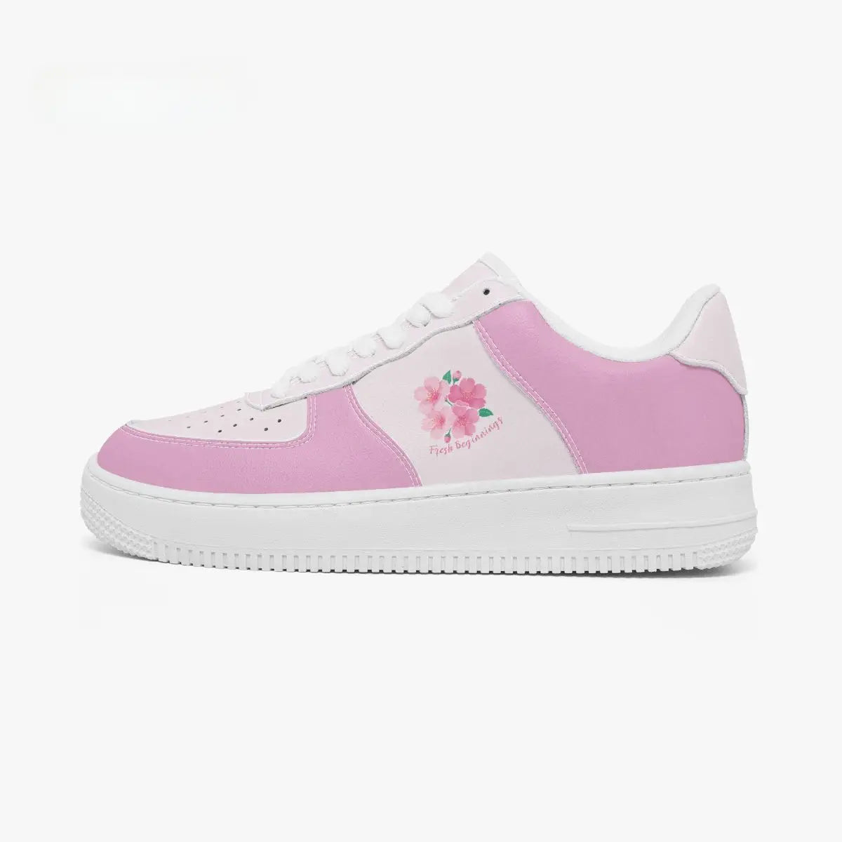 A pink and white low-top sneaker with a floral graphic on the side panel, shown in profile against a plain white background.