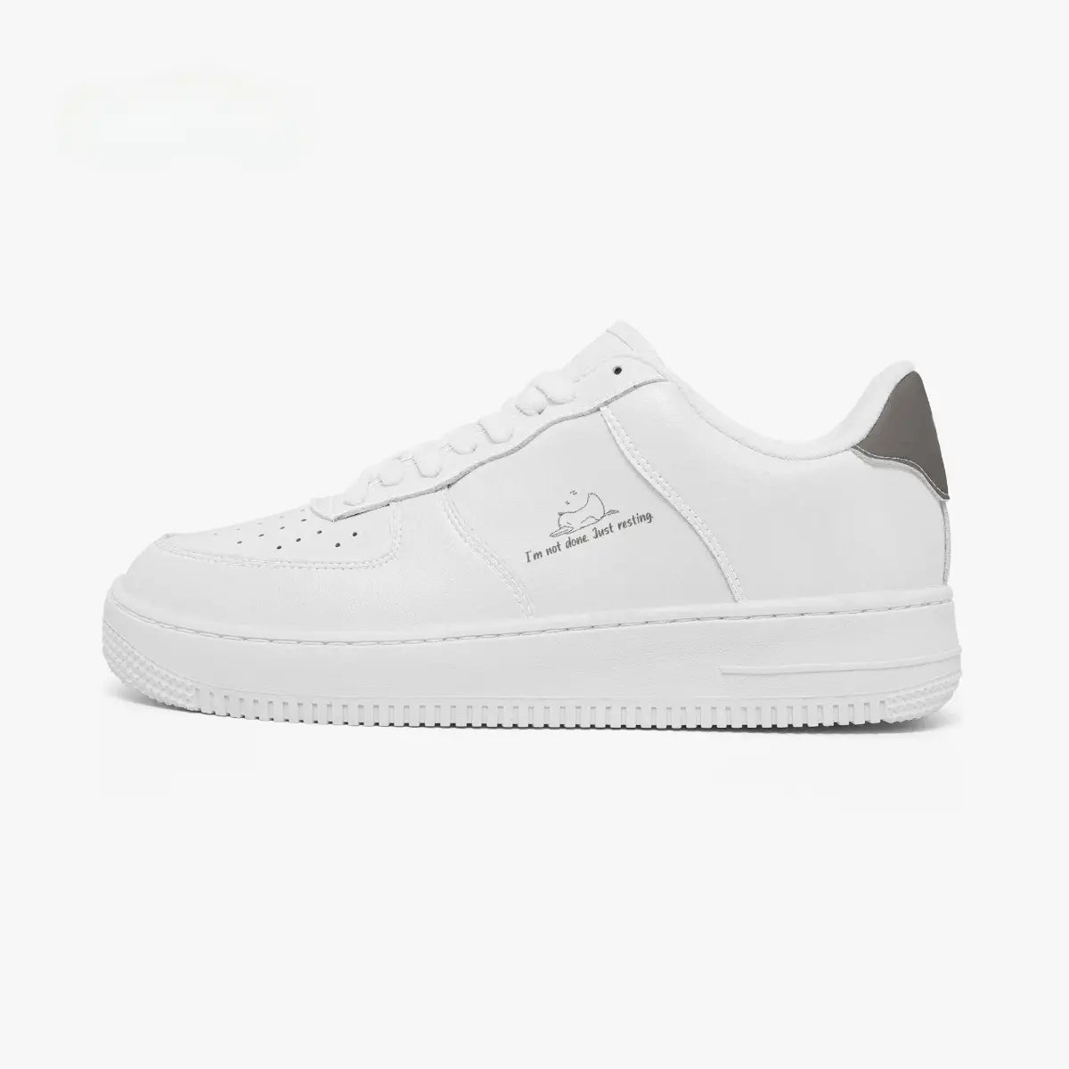 A white low-top sneaker with a gray heel accent and a small graphic print on the side, shown in profile against a plain white background.