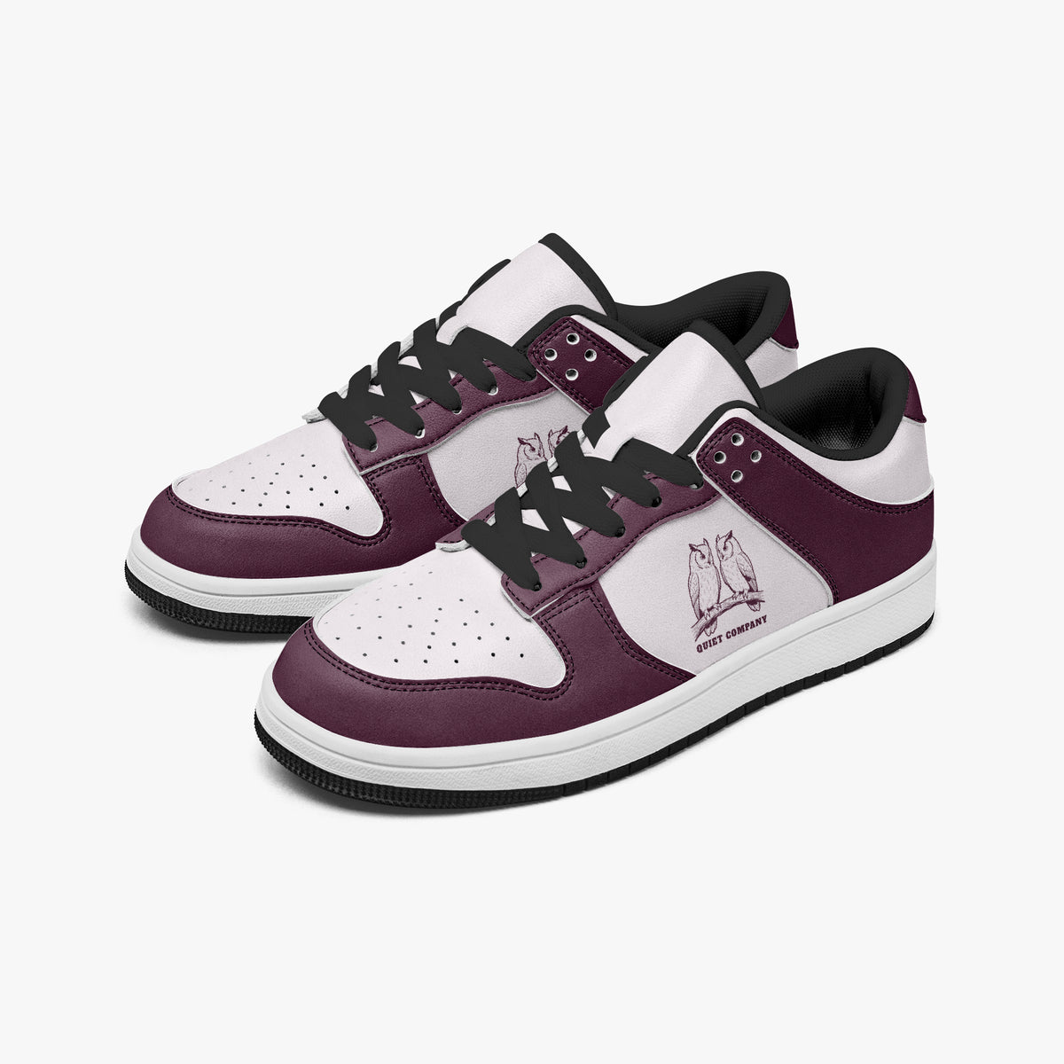 Angled three-quarter view of low-top sneakers in burgundy and pale pink leather, featuring an owl illustration with "QUIET COMPANY", black laces, and a black inner lining.