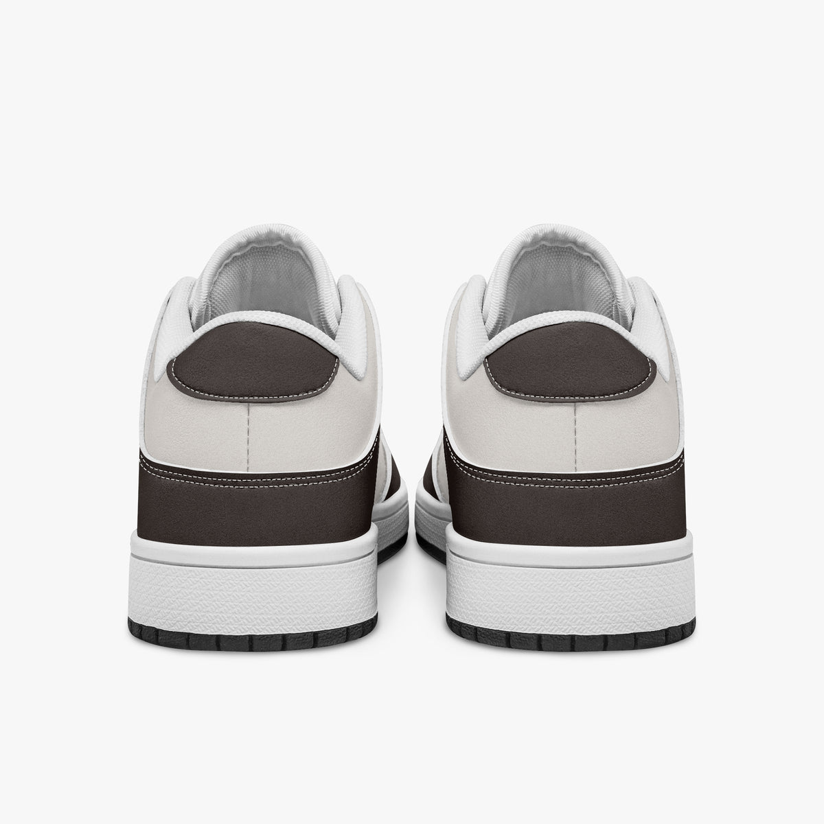 Rear view of dark brown and off-white sneakers displaying espresso brown heel overlays, off-white leather collar panels, and two-tone white and black rubber outsoles.