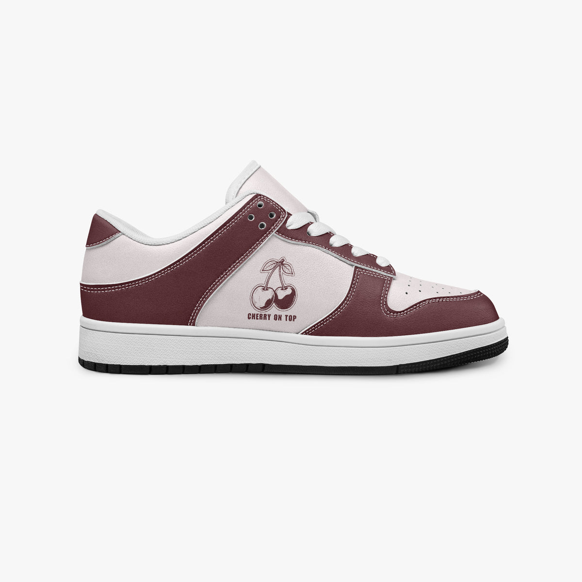 Side profile view of the right sneaker showcasing the burgundy leather overlays, cherry graphic, white eyelet lacing, and contrasting black outsole facing right.