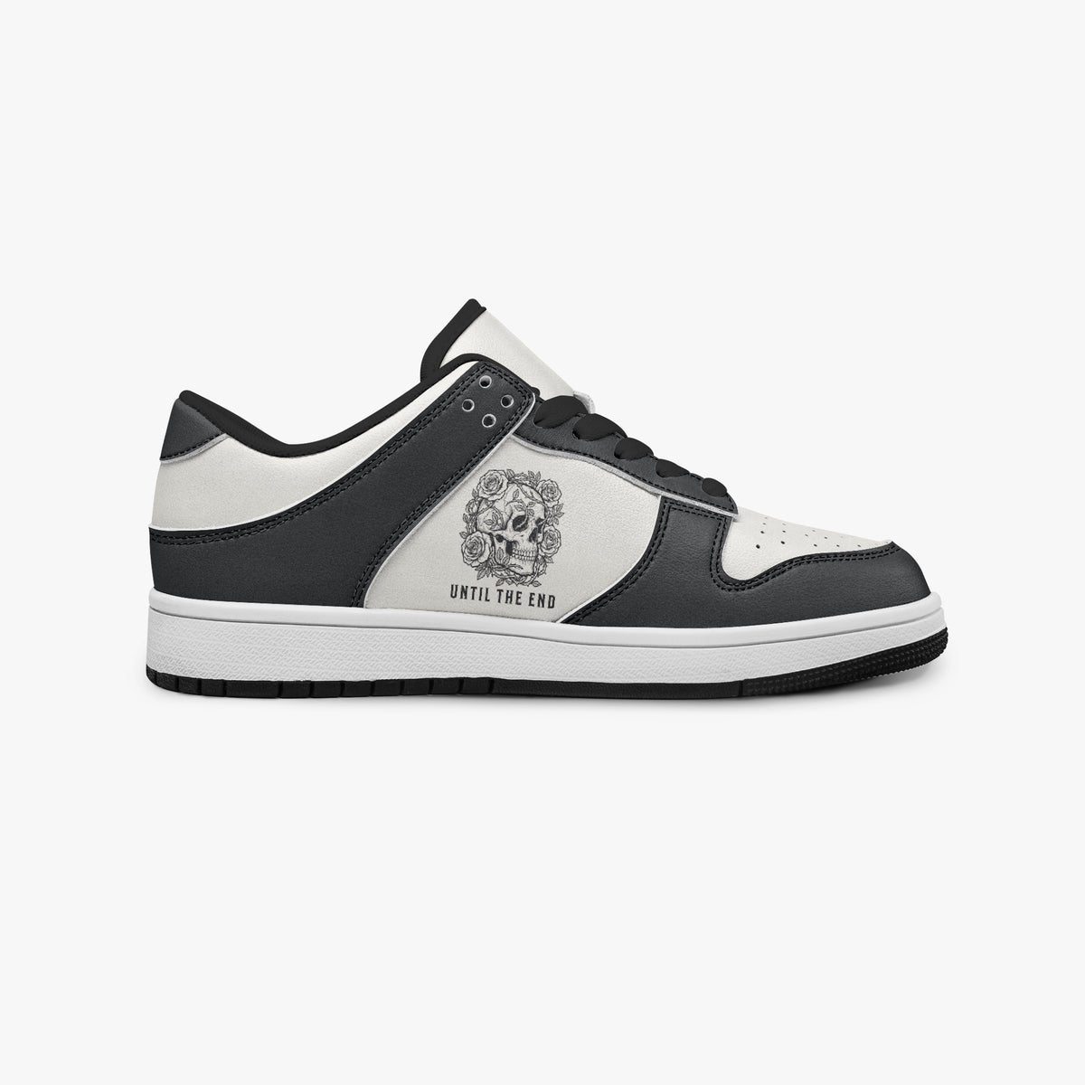 Side profile view of the right sneaker showcasing the black and white color blocking, "UNTIL THE END" graphic, black laces, and black rubber outsole facing right.