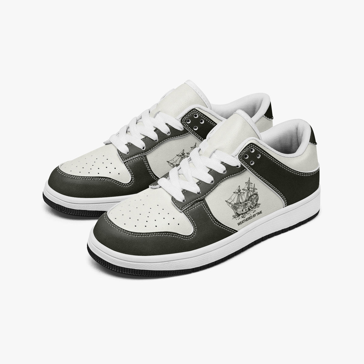 Angled three-quarter view of low-top sneakers in charcoal olive-grey and off-white leather, featuring a sailing vessel graphic with "WEATHERED BY TIME", white laces, and a white inner lining.