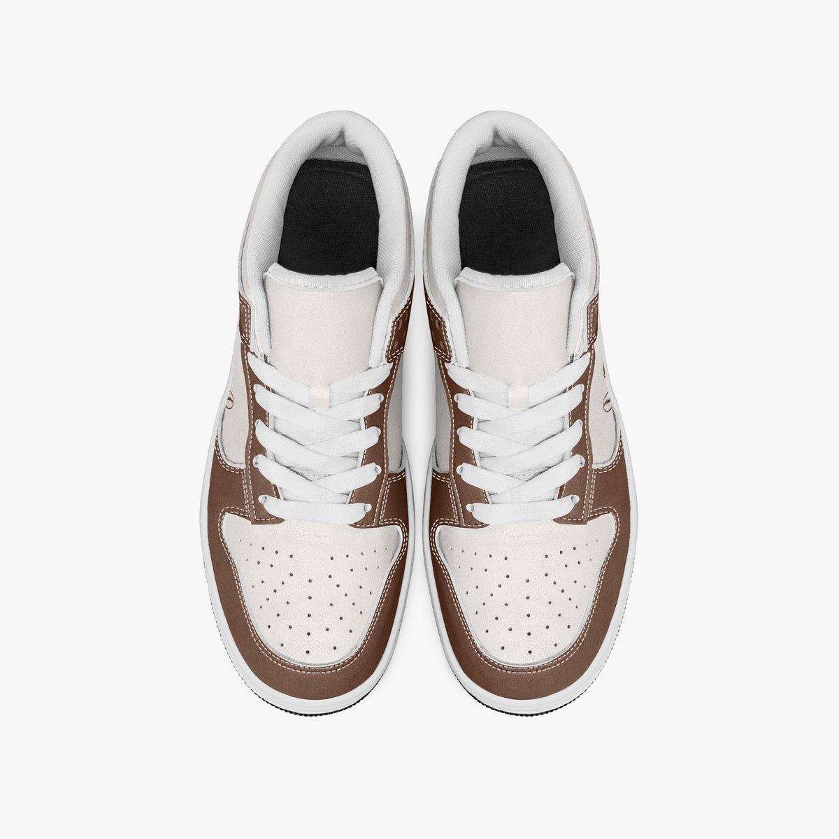 Overhead view of brown and cream sneakers showing clean white laces, white padded collar lining, and perforated cream leather toe boxes.