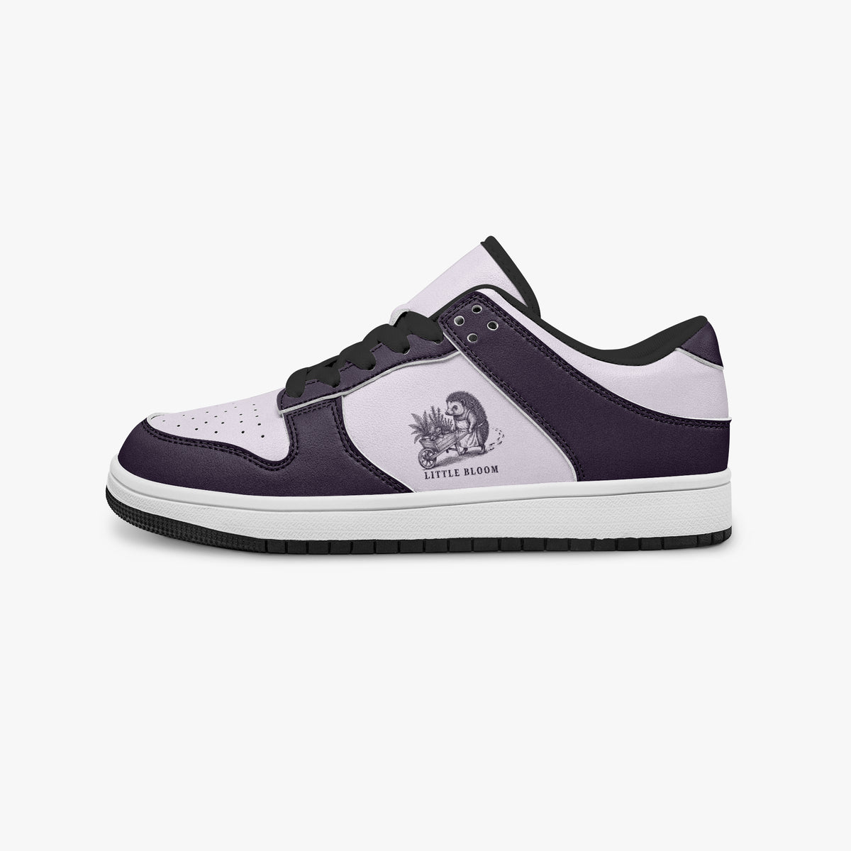 Side profile view of the left sneaker highlighting deep purple leather panels, hedgehog graphic with "LITTLE BLOOM", black interior lining, and flat rubber sole facing right.