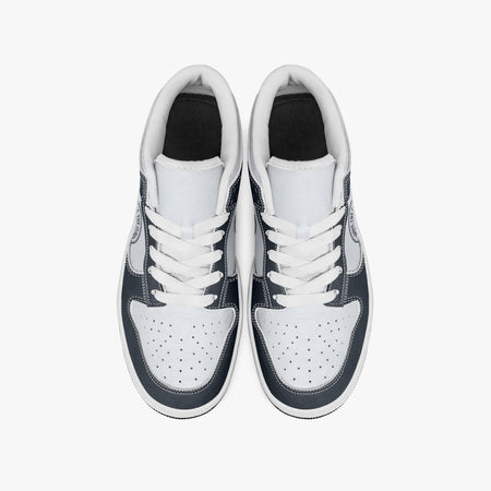 Overhead view of navy blue and off-white sneakers showing clean white laces, white padded collar lining, and perforated white leather toe boxes.