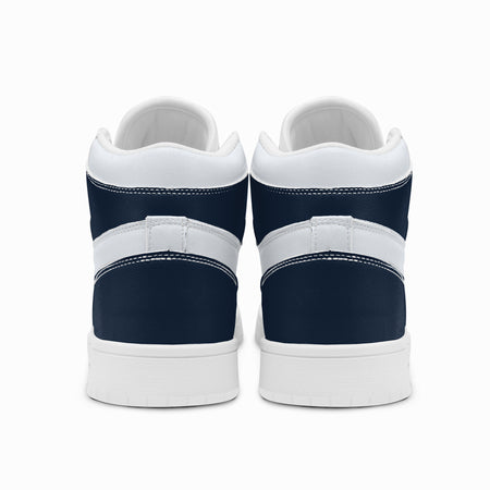 Rear view of navy blue and white high-top sneakers displaying dark navy heel counters, white collar bands, and two-tone white and dark grey rubber outsoles.