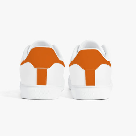 A pair of white low-top sneakers shown from the back, featuring a prominent orange heel tab design, set against a clean white background.