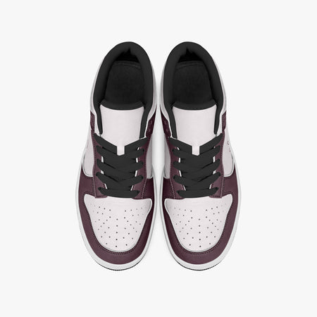 Overhead view of burgundy and pale pink sneakers displaying black laces, black padded collar lining, and perforated pale pink leather toe boxes.