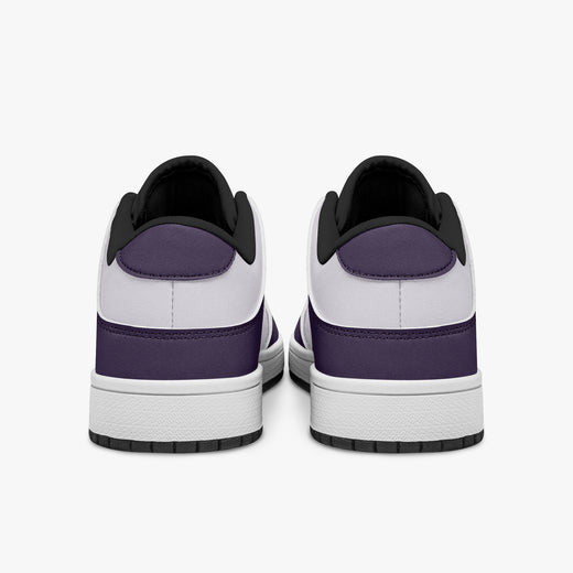 Rear view of deep purple and white sneakers displaying purple heel overlays, white leather collars, and two-tone rubber outsoles.