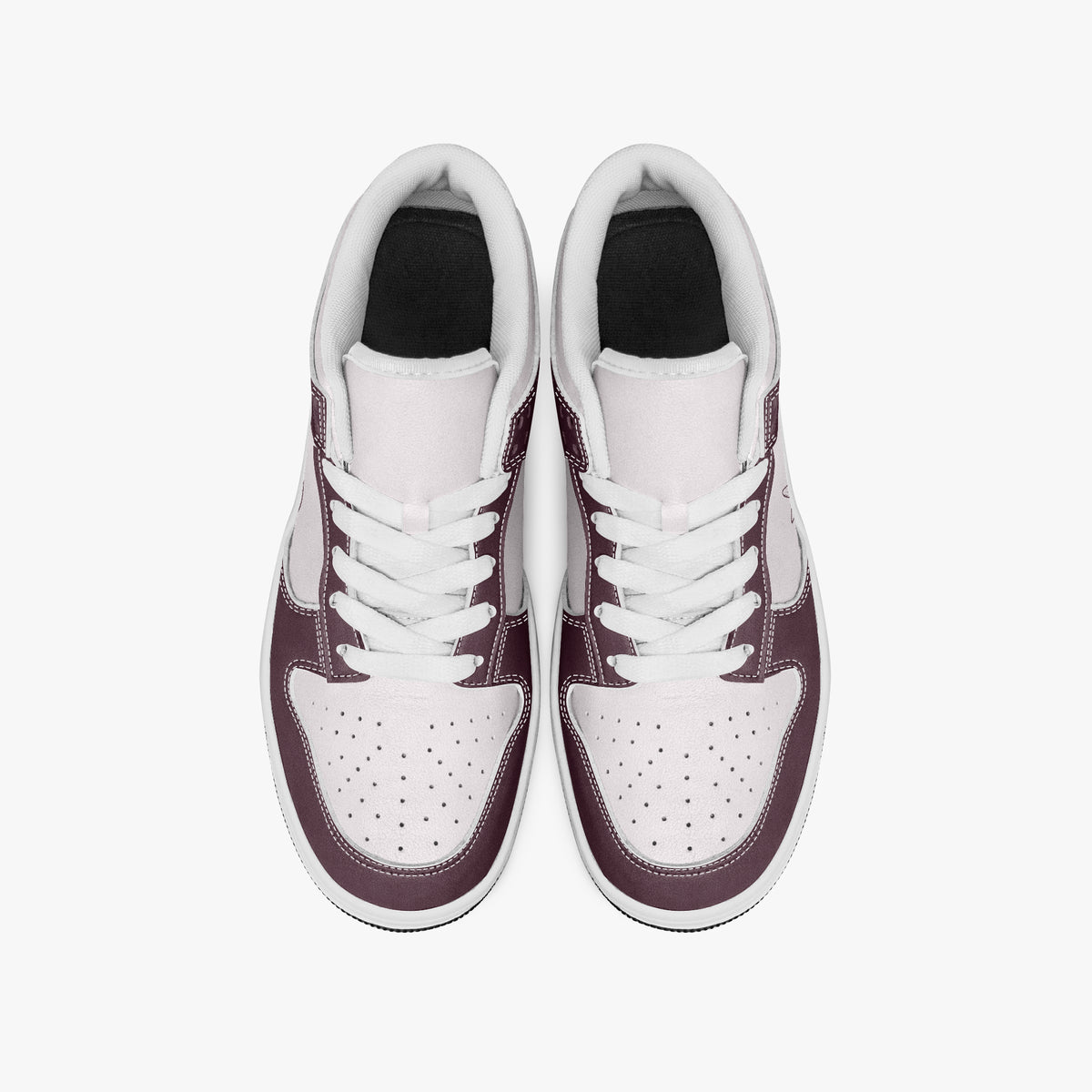 Overhead view of burgundy and pale pink sneakers showing clean white laces, white padded collar lining, and perforated pale pink toe boxes.