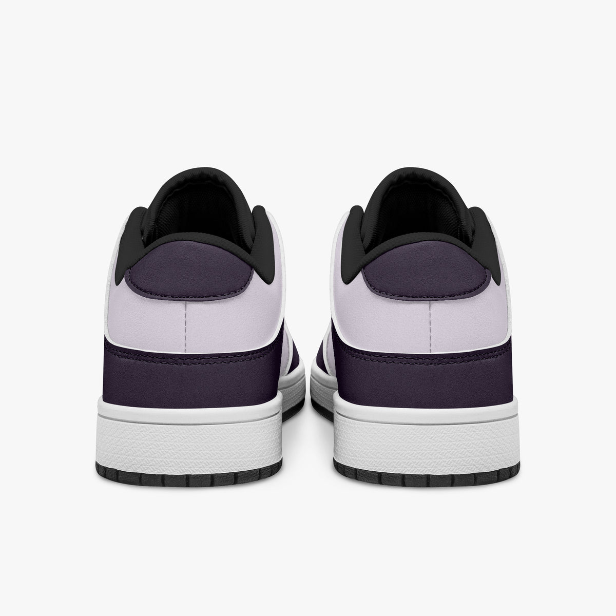 view of plum purple and lilac sneakers showing deep purple heel overlays, pale lilac leather collars, and black interior collar lining above white midsoles.