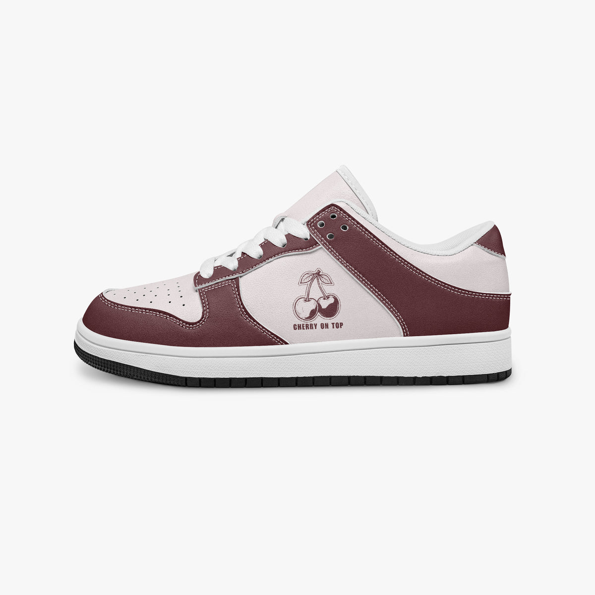 Side profile view of the left sneaker in burgundy and pale pink leather, highlighting the "CHERRY ON TOP" graphic, white laces, white interior lining, and flat rubber sole facing right.